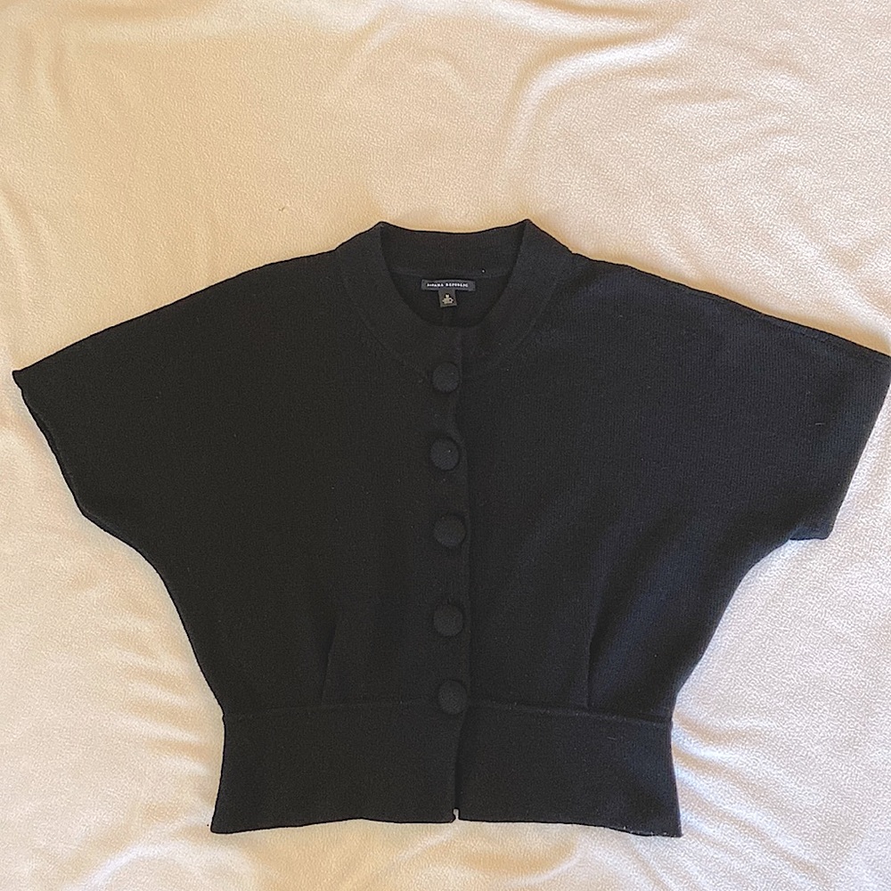 Wool sweater with fabric covered oversized buttons.